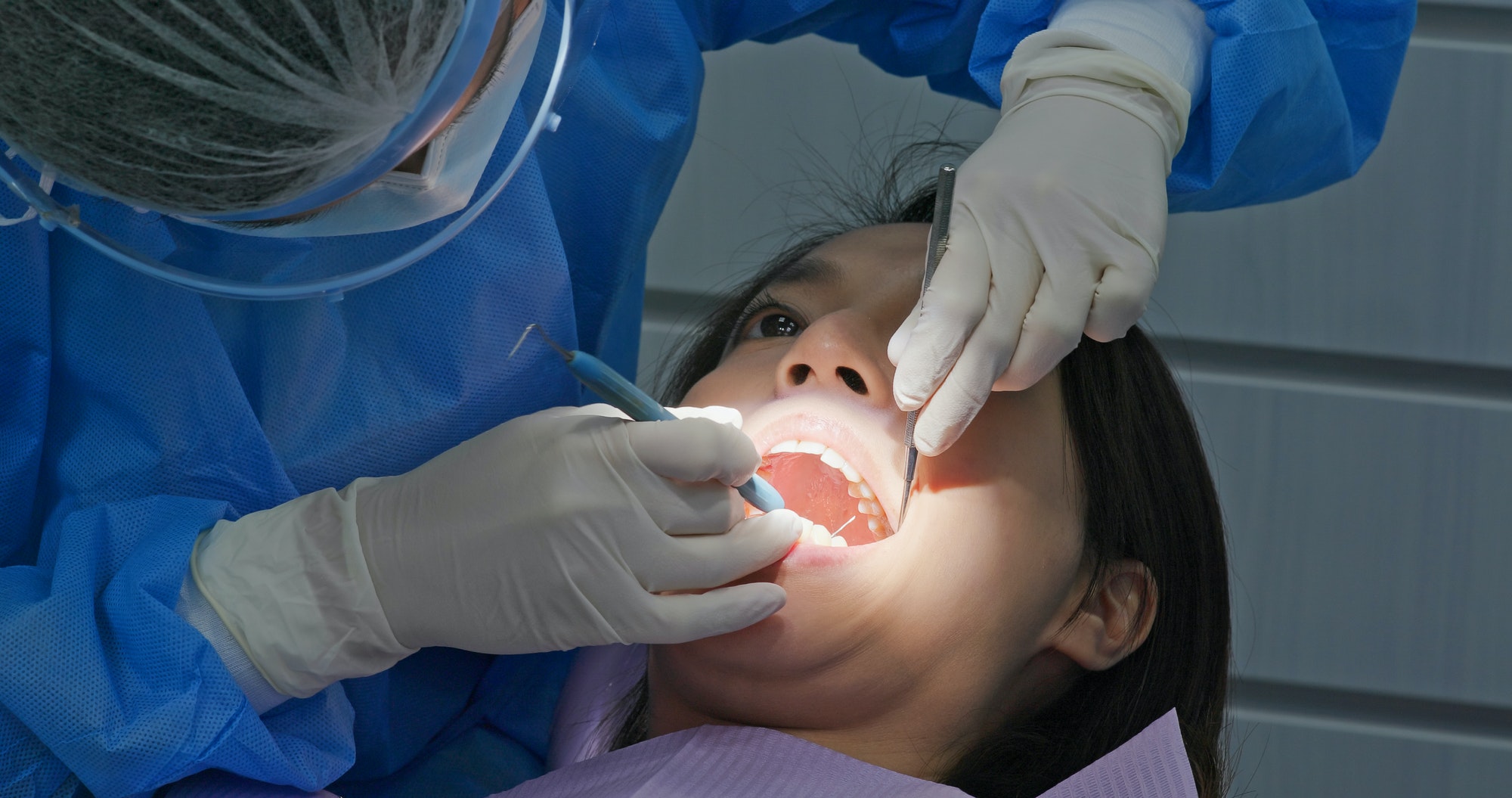Woman undergo dental scaling treatment